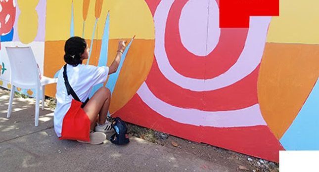 Mural comunitario de Elena Ho y Payo ilumina perímetro de edificio corporativo de B. Santander